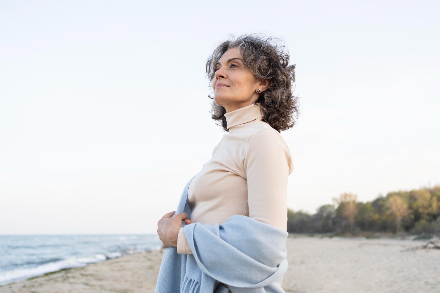 older woman looking out to the ocean